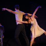 Kevin Aubin and Kaitana Magno, with Jordan Spencer in the background, in Common Grounds at NYMF.